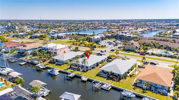 an aerial view of residential houses with outdoor space