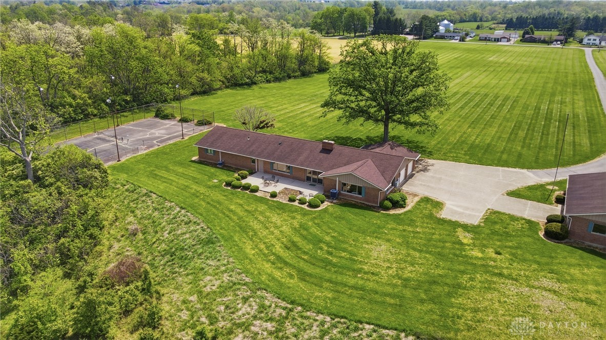 5669 O Neall Road Waynesville, OH 45068 - Photo 14 of 72 This expansive estate offers a sprawling lawn, private tennis court, and ample outdoor living space.