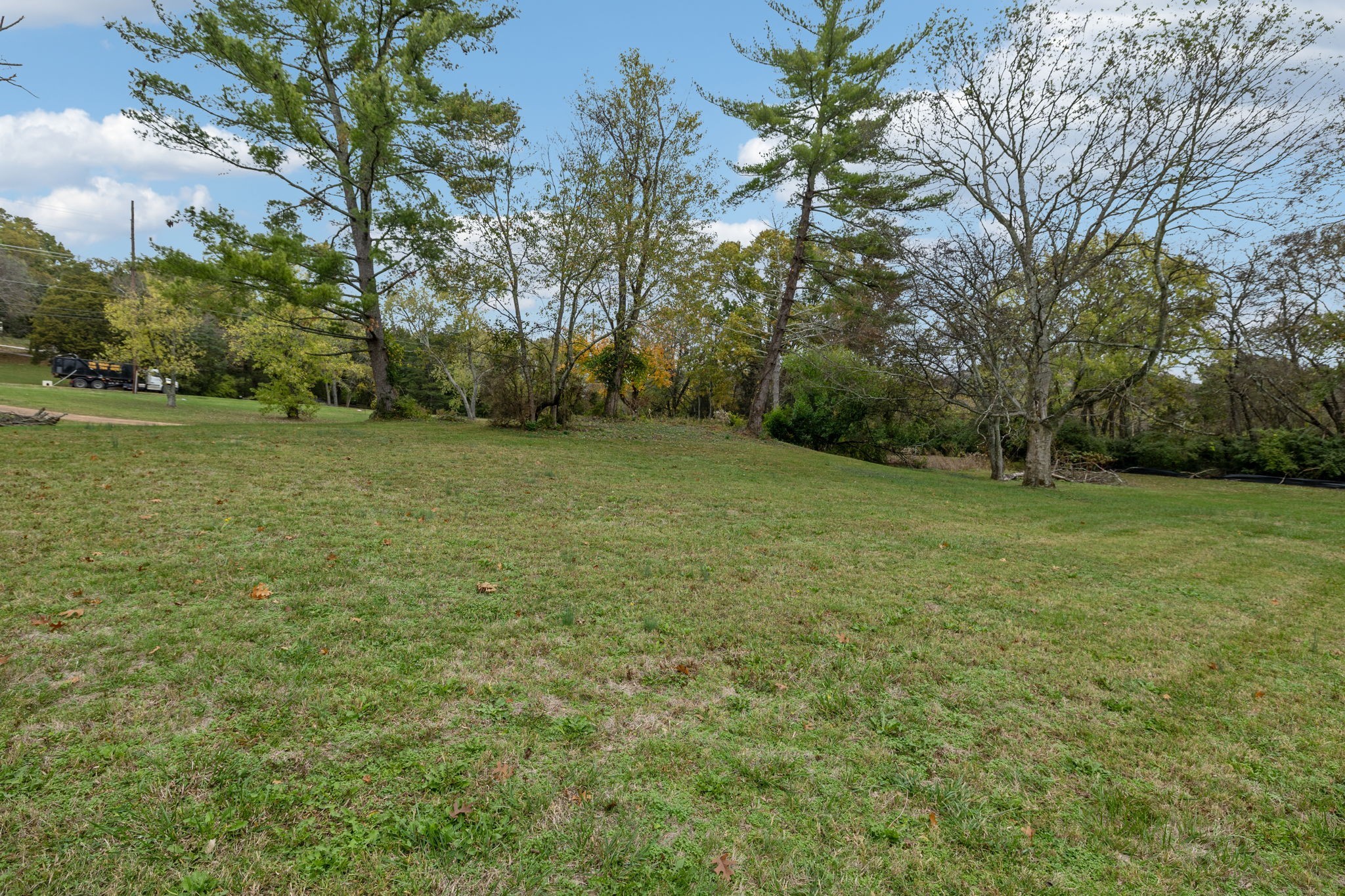 1917 Old Hickory Boulevard Brentwood, TN 37027 - Photo 11 of 49 a view of a field with trees in the background