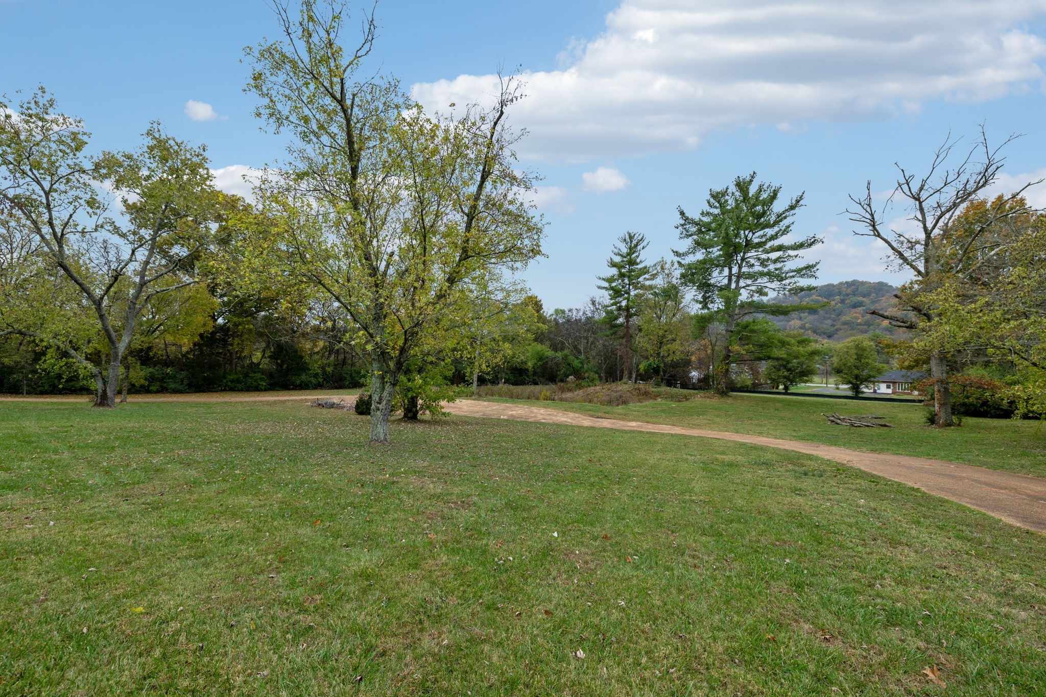 1917 Old Hickory Boulevard Brentwood, TN 37027 - Photo 2 of 49 a view of a field of grass and trees