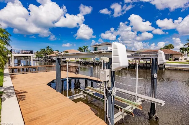 a roof deck with table and chairs