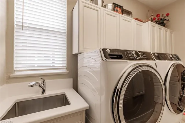 a utility room with dryer and washer