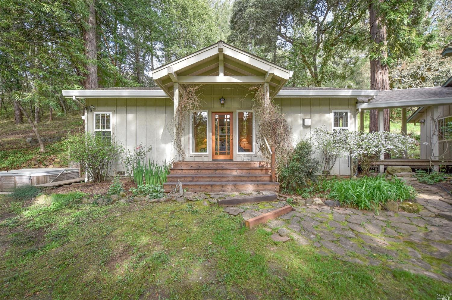 a front view of a house with garden
