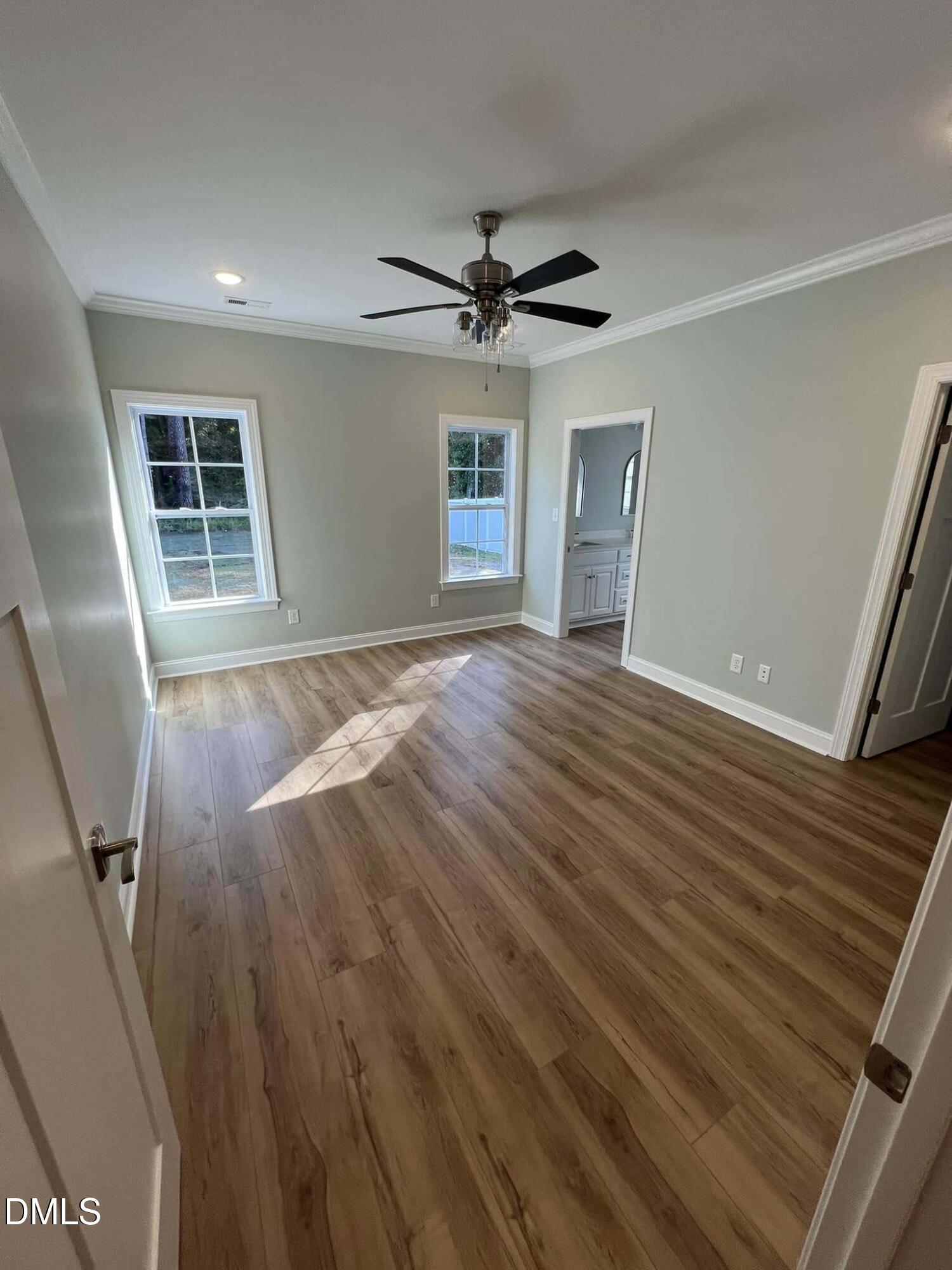 10 H Good Shepherd Trail Spring Spring Hope, NC 27882 - Photo 18 of 34 a view of empty room with wooden floor and fan