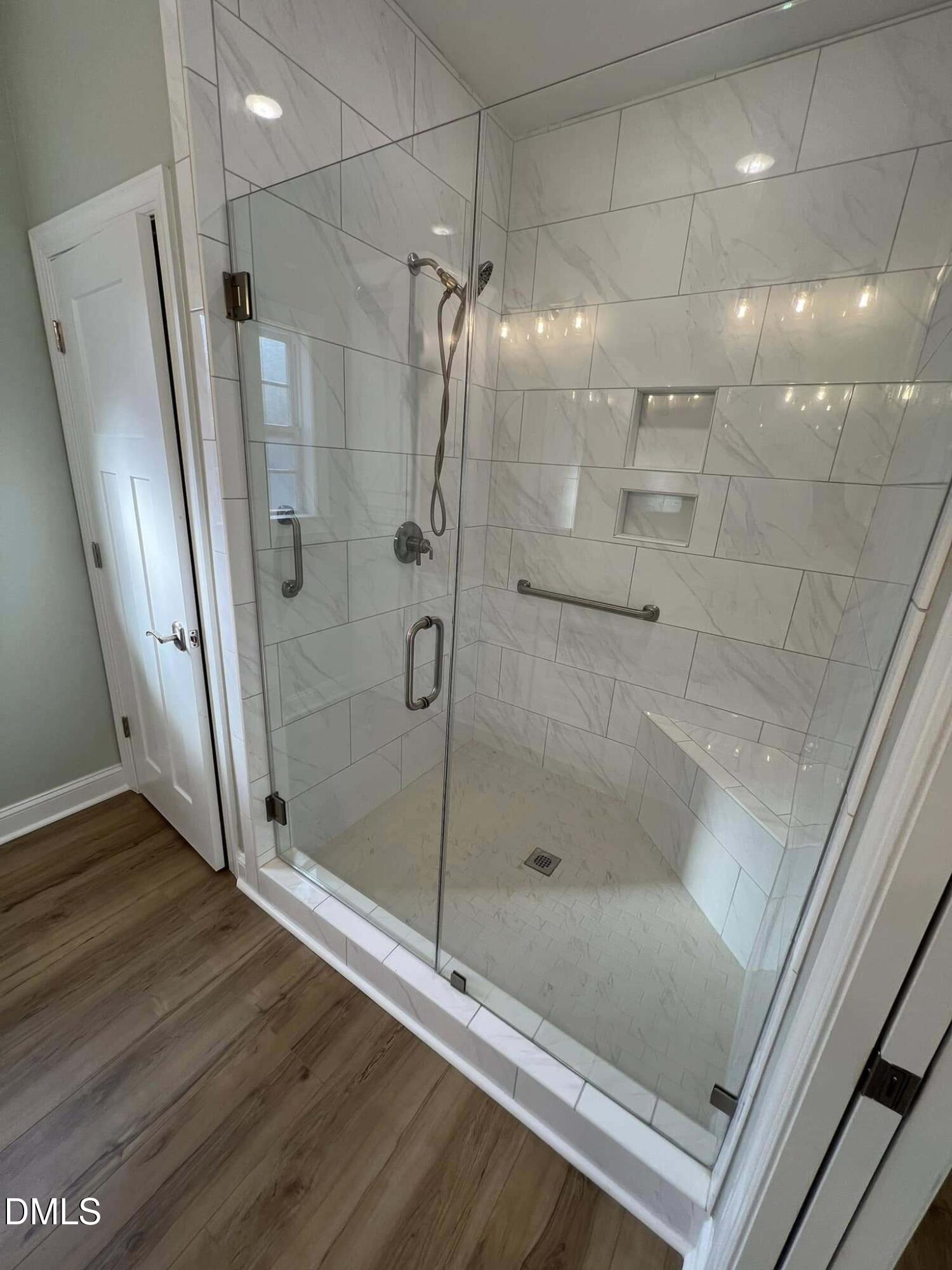10 H Good Shepherd Trail Spring Spring Hope, NC 27882 - Photo 20 of 34 a bathroom with a glass shower door and a sink