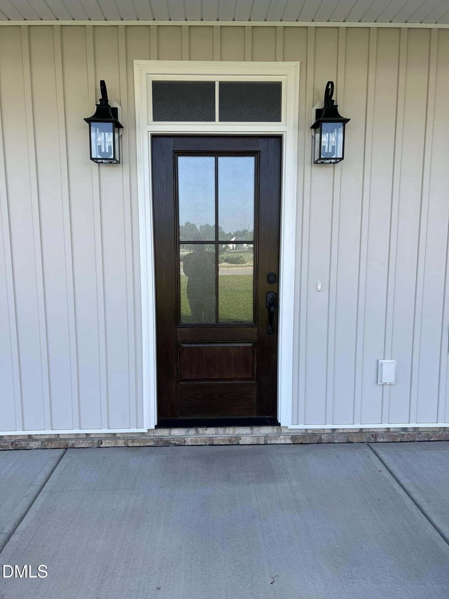 10 H Good Shepherd Trail Spring Spring Hope, NC 27882 - Photo 2 of 34 a view of a entryway door of the house and living room