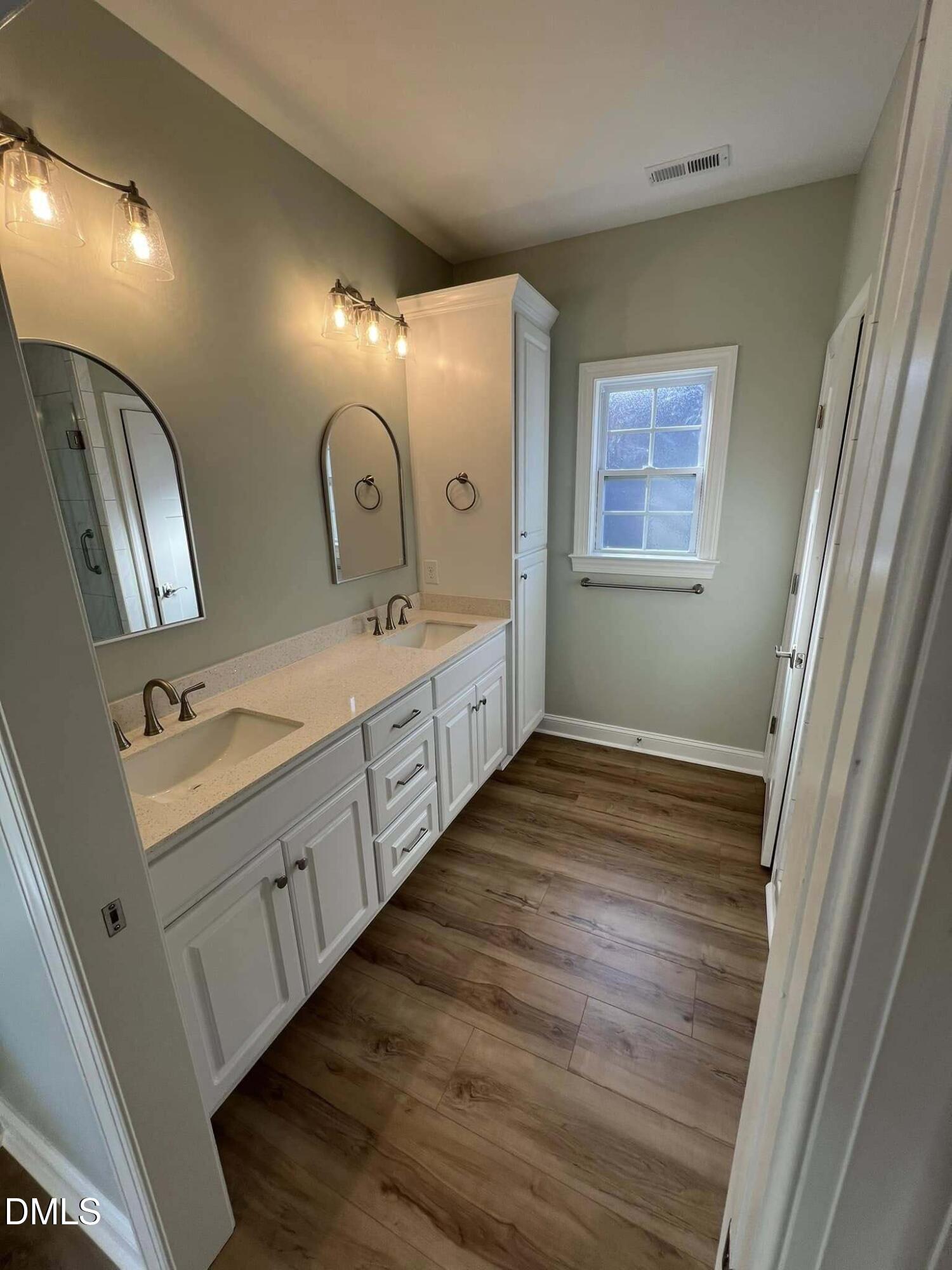 10 H Good Shepherd Trail Spring Spring Hope, NC 27882 - Photo 24 of 34 a bathroom with 2 sink and a mirror
