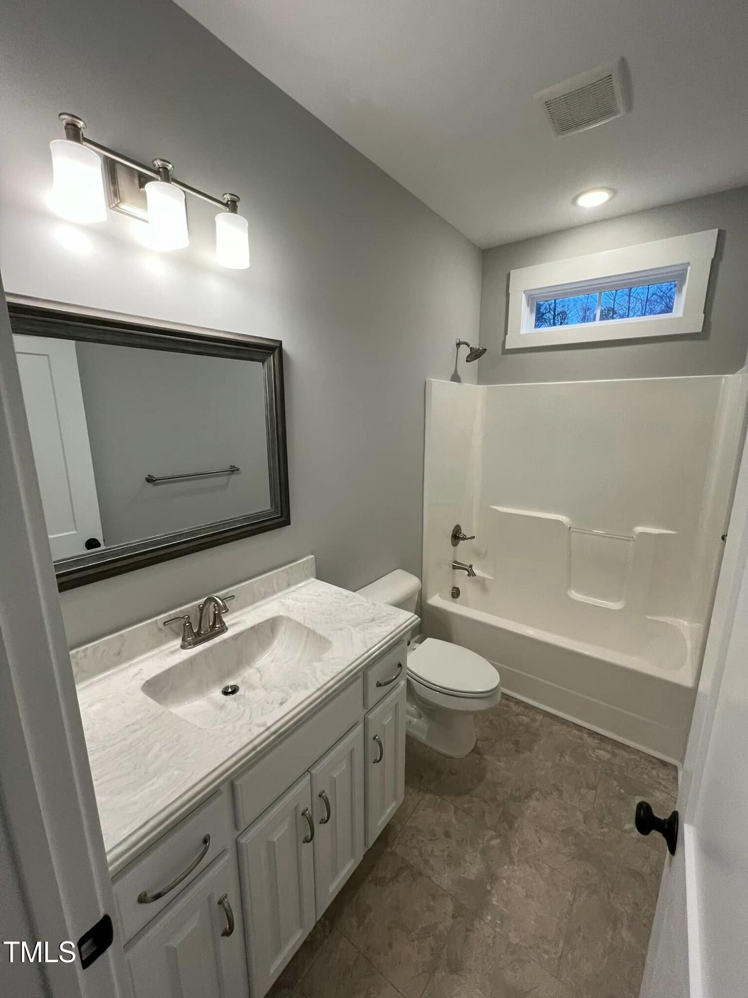 10 H Good Shepherd Trail Spring Spring Hope, NC 27882 - Photo 26 of 34 a bathroom with a double vanity sink toilet mirror and bathtub