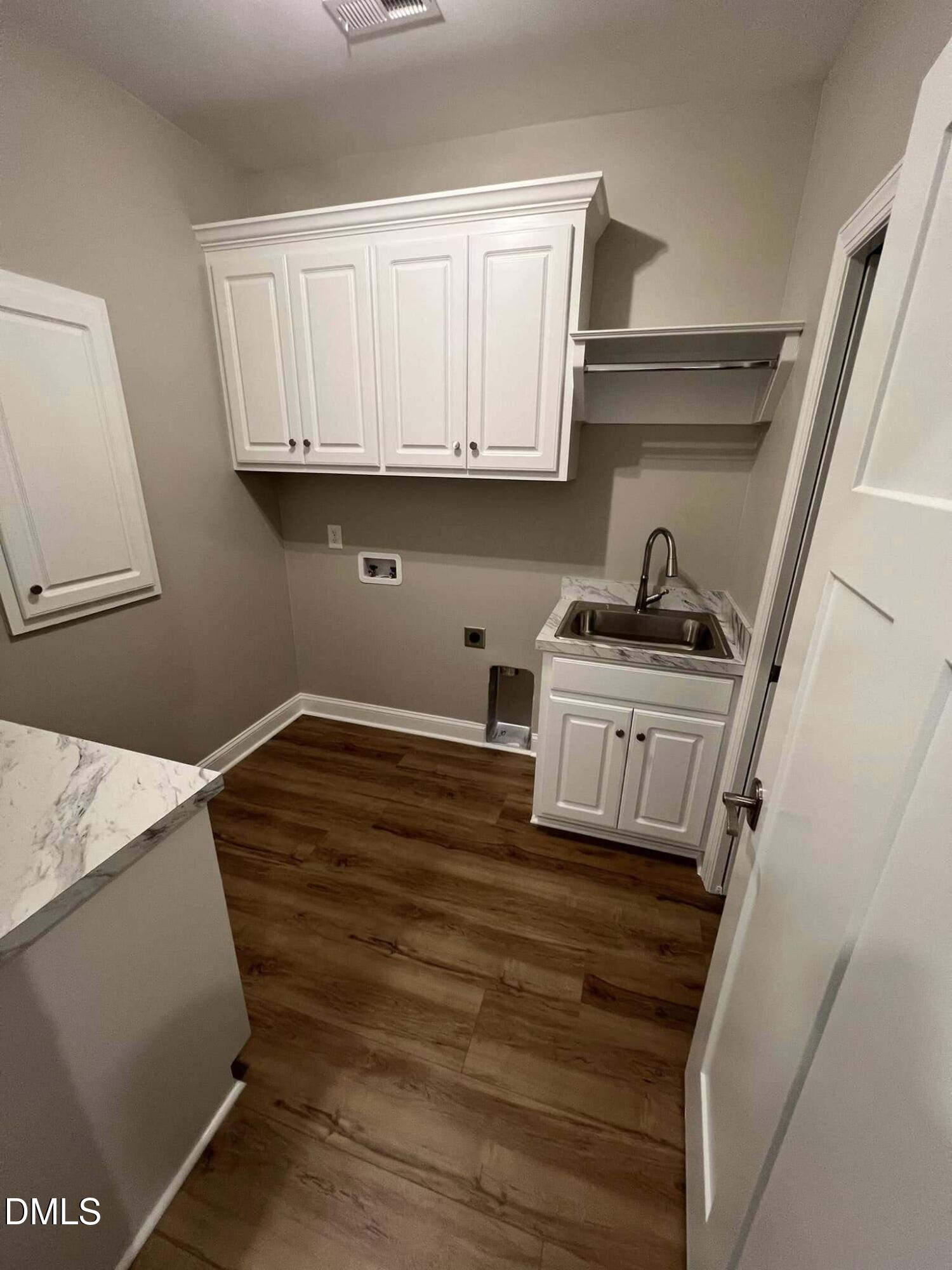 10 H Good Shepherd Trail Spring Spring Hope, NC 27882 - Photo 31 of 34 a room with wooden cabinets and a sink