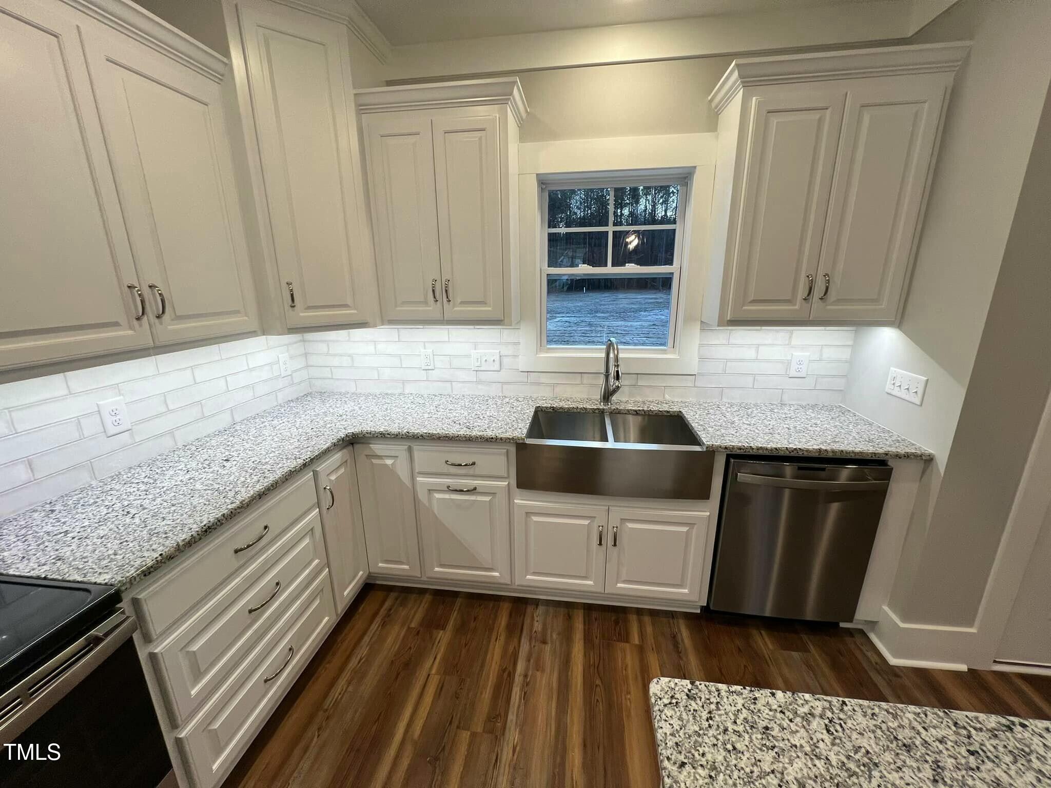 10 H Good Shepherd Trail Spring Spring Hope, NC 27882 - Photo 5 of 34 a kitchen with granite countertop a sink and a stove