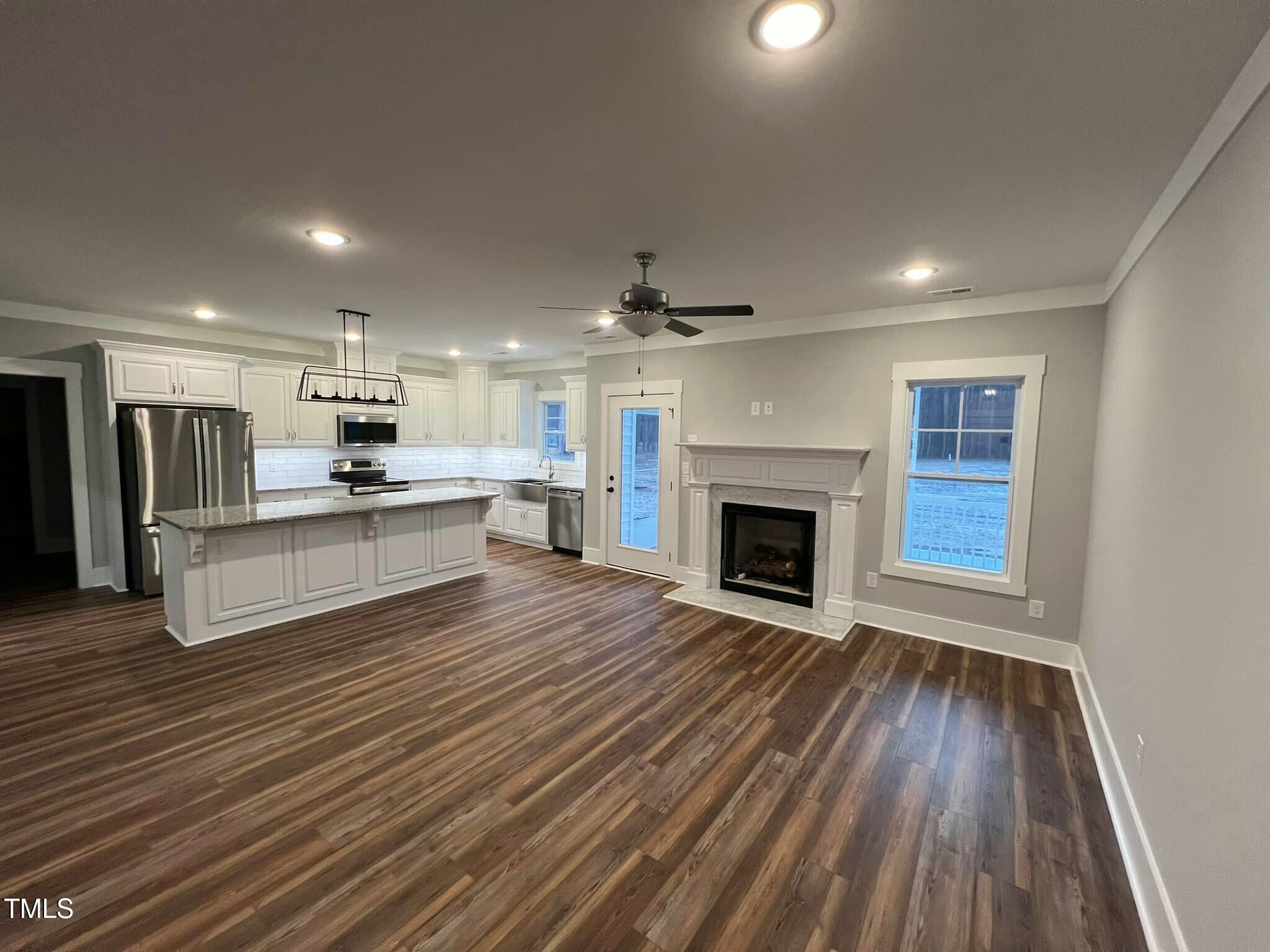 10 H Good Shepherd Trail Spring Spring Hope, NC 27882 - Photo 6 of 34 a view of kitchen with granite countertop cabinets and wooden floor