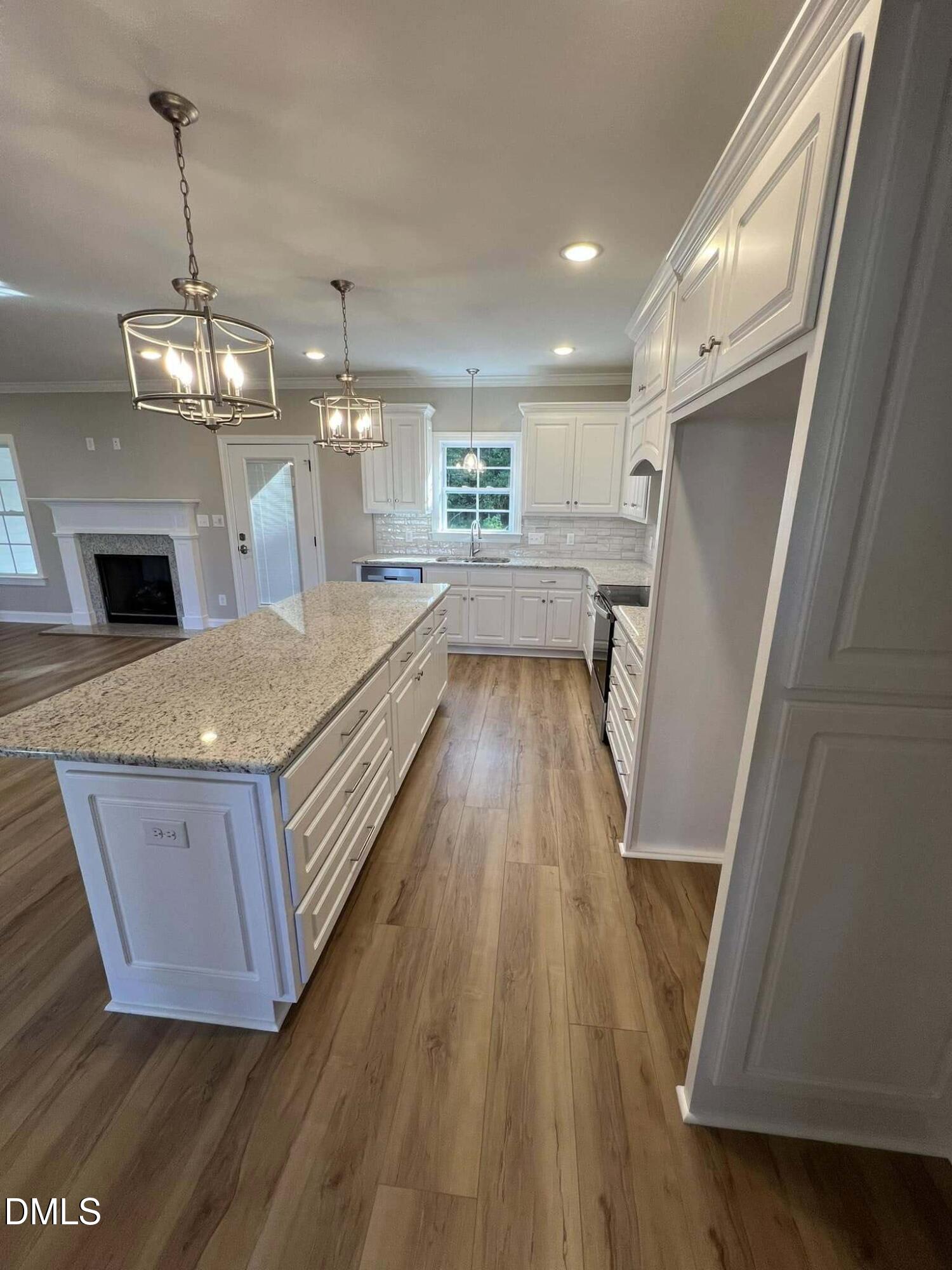 10 H Good Shepherd Trail Spring Spring Hope, NC 27882 - Photo 8 of 34 a view of living room with wooden floor and fireplace