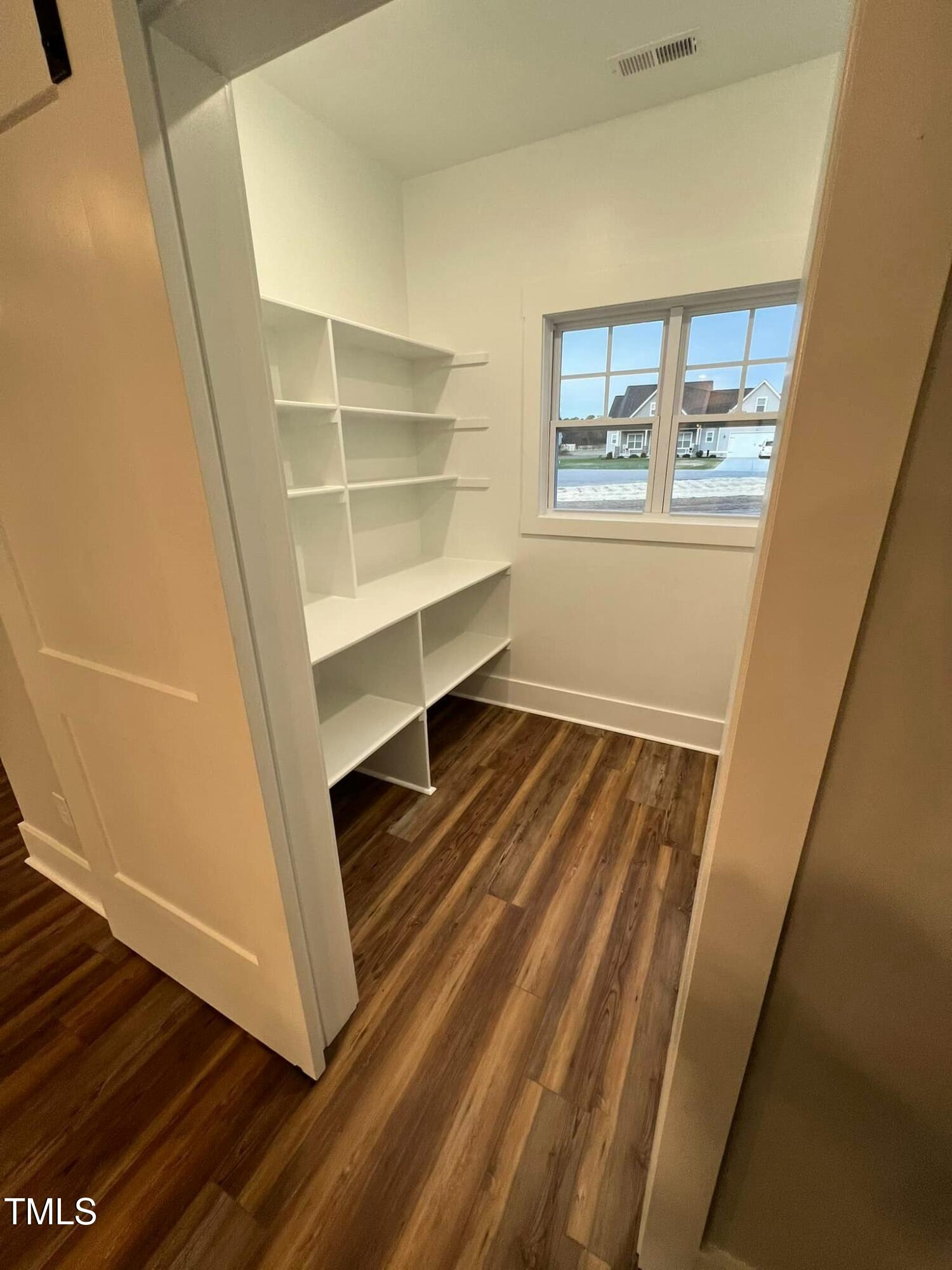10 H Good Shepherd Trail Spring Spring Hope, NC 27882 - Photo 10 of 34 a room with wooden floor and white walls