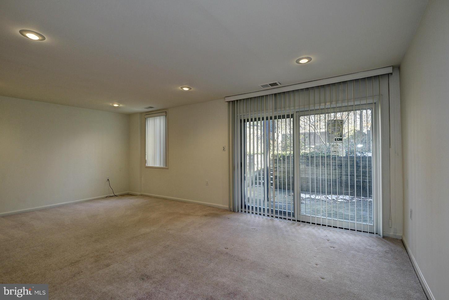 7942 Inverness Ridge Road Potomac, MD 20854 - Photo 22 of 24 a view of an empty room with glass door