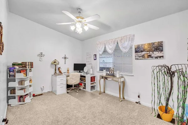 a view of a workspace with furniture and a livingroom