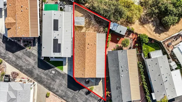 a front view of a house with wooden fence