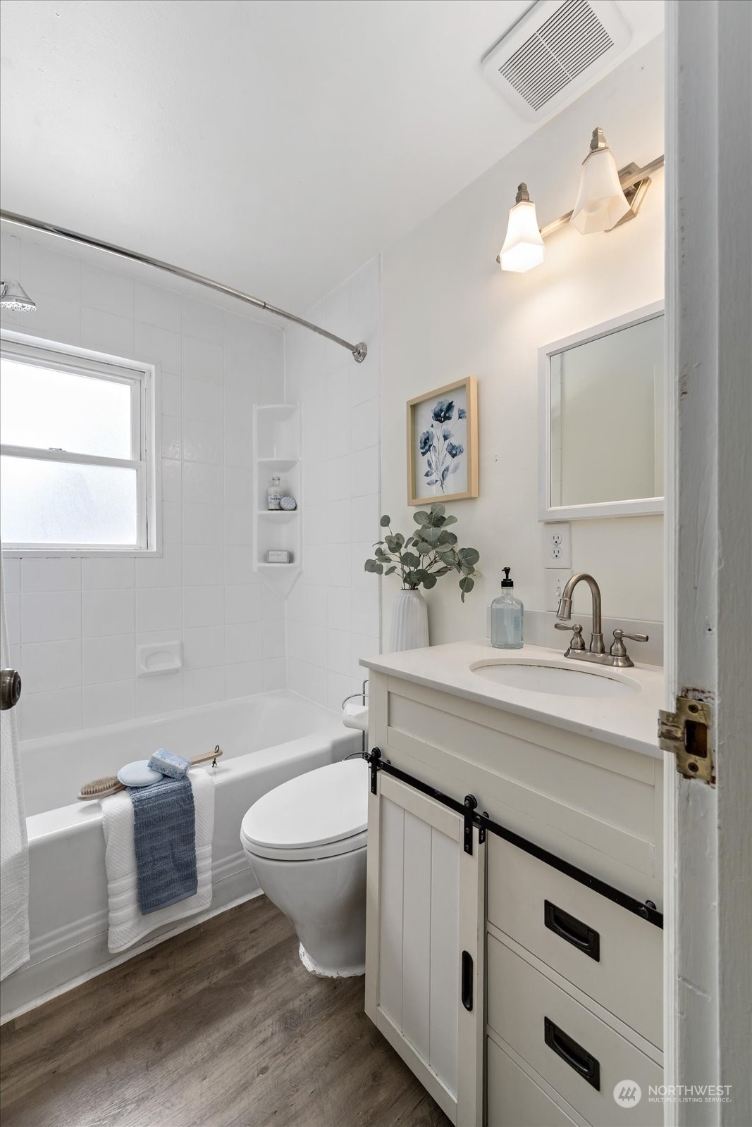 4839 50th Avenue Southwest Seattle, WA 98116 - Photo 13 of 31 a bathroom with a granite countertop sink mirror vanity and toilet