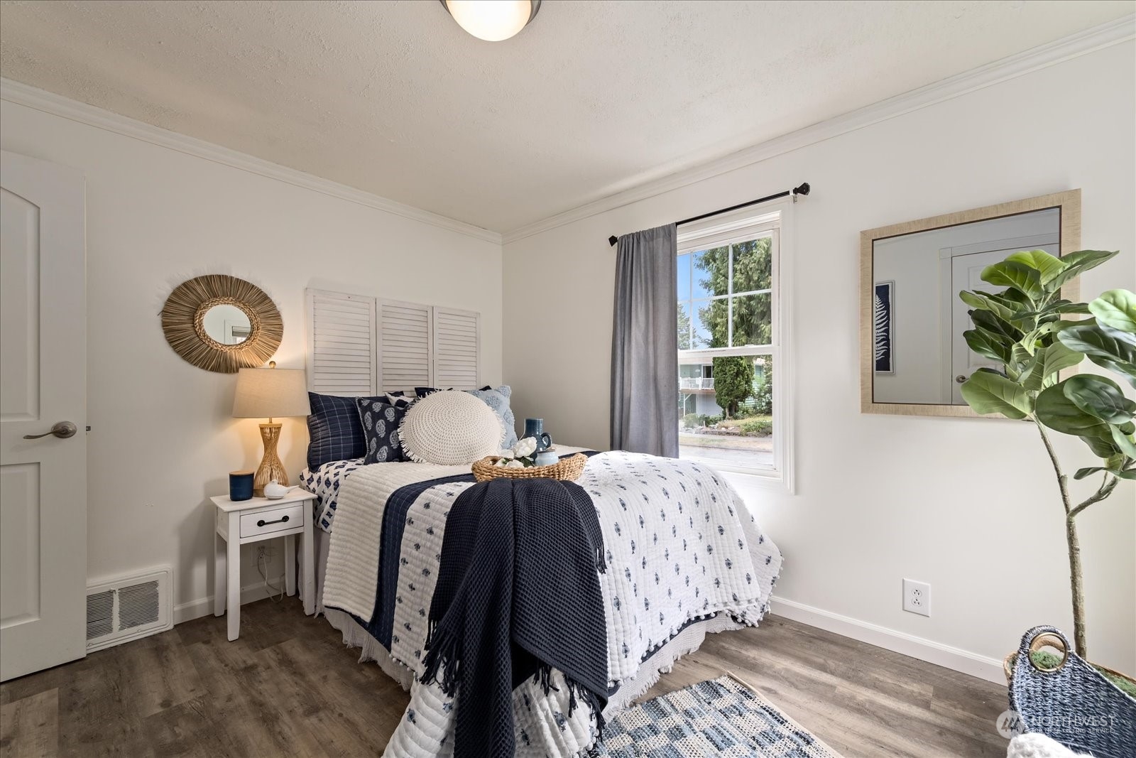 4839 50th Avenue Southwest Seattle, WA 98116 - Photo 17 of 31 a bedroom with a bed and a window