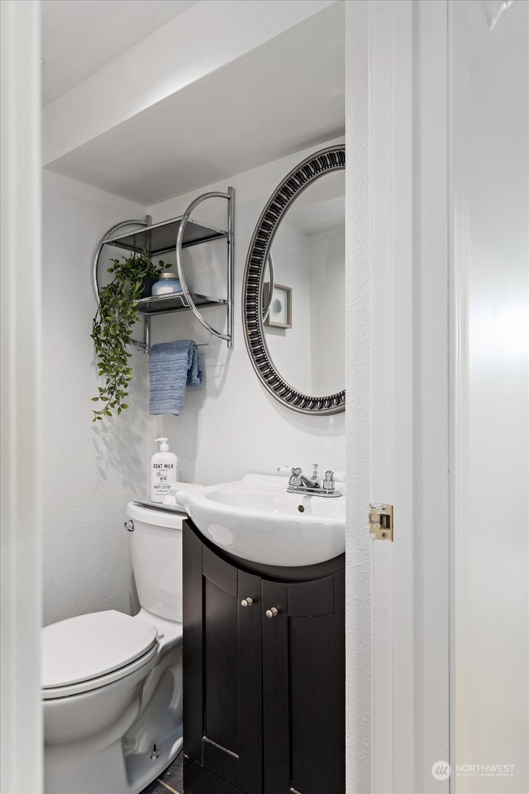 4839 50th Avenue Southwest Seattle, WA 98116 - Photo 20 of 31 a bathroom with a sink a toilet and a mirror