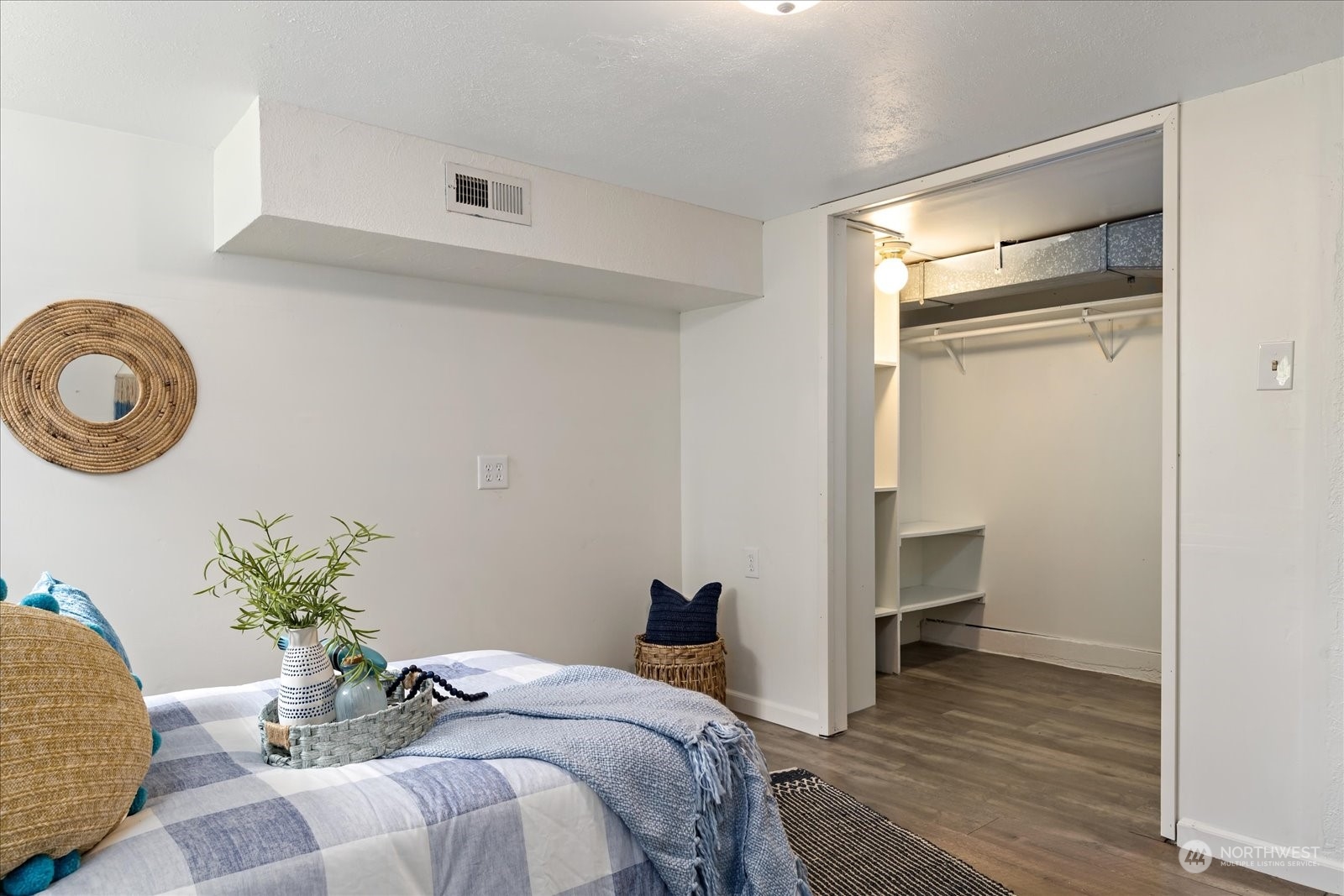 4839 50th Avenue Southwest Seattle, WA 98116 - Photo 22 of 31 a bedroom with a bed and a chandelier