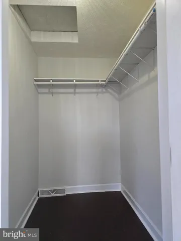 a view of an empty walk in closet