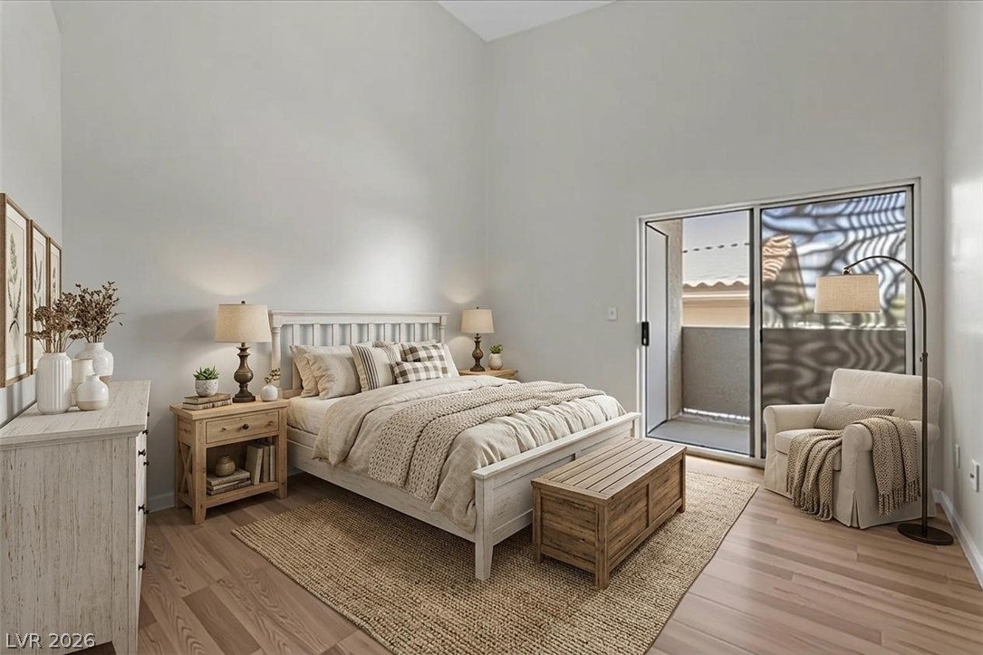 1881 West Alexander Road, Unit 1037 North Las Vegas, NV 89032 - Photo 13 of 31 Virtually Staged -A private patio extends the serene primary bedroom, offering an outdoor retreat.