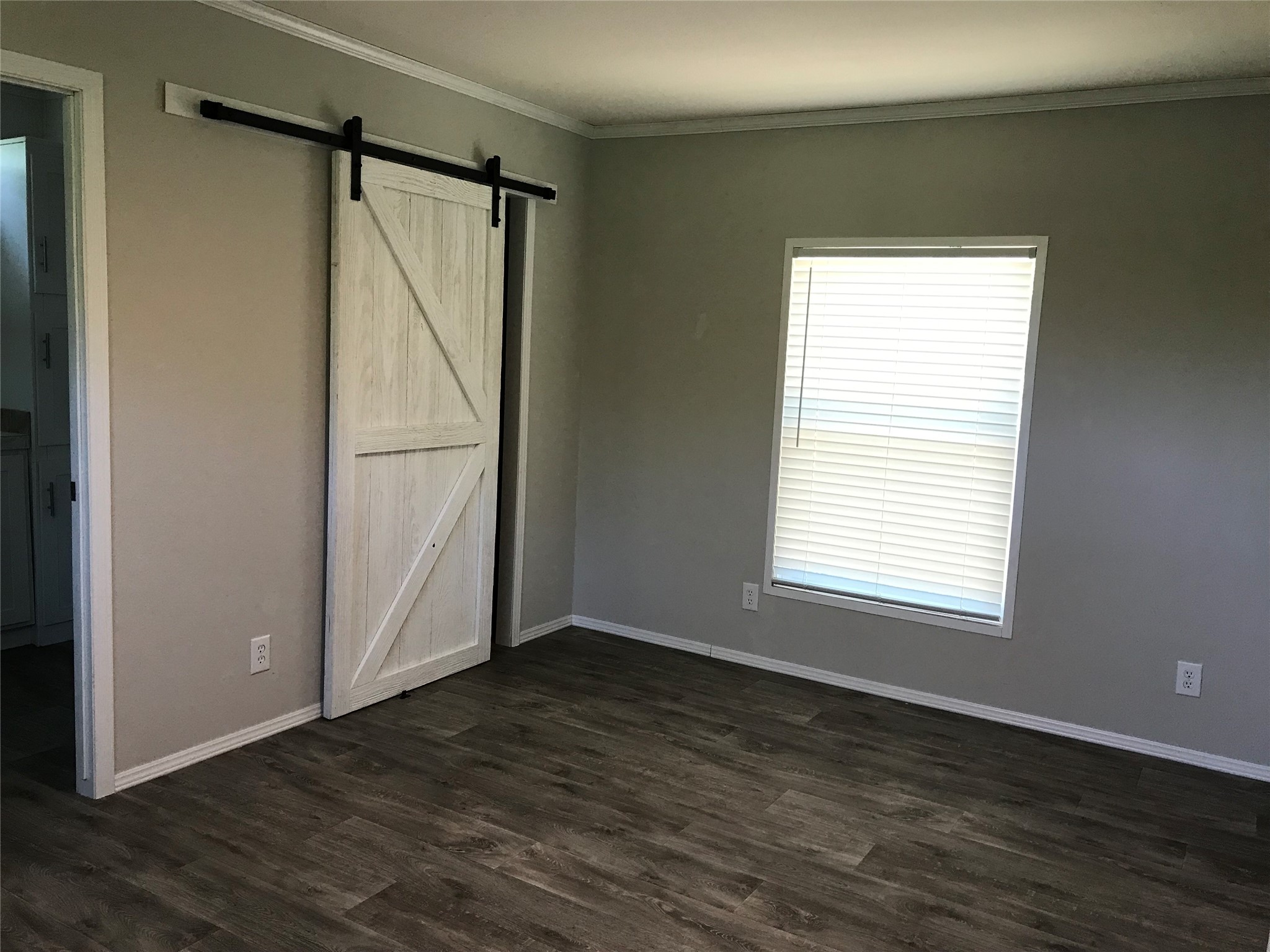 246 Brenda Road Trinity, TX 75862 - Photo 8 of 28 a view of an empty room with wooden floor and a window