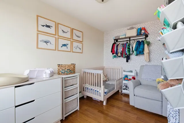 a bedroom with furniture and a book shelf