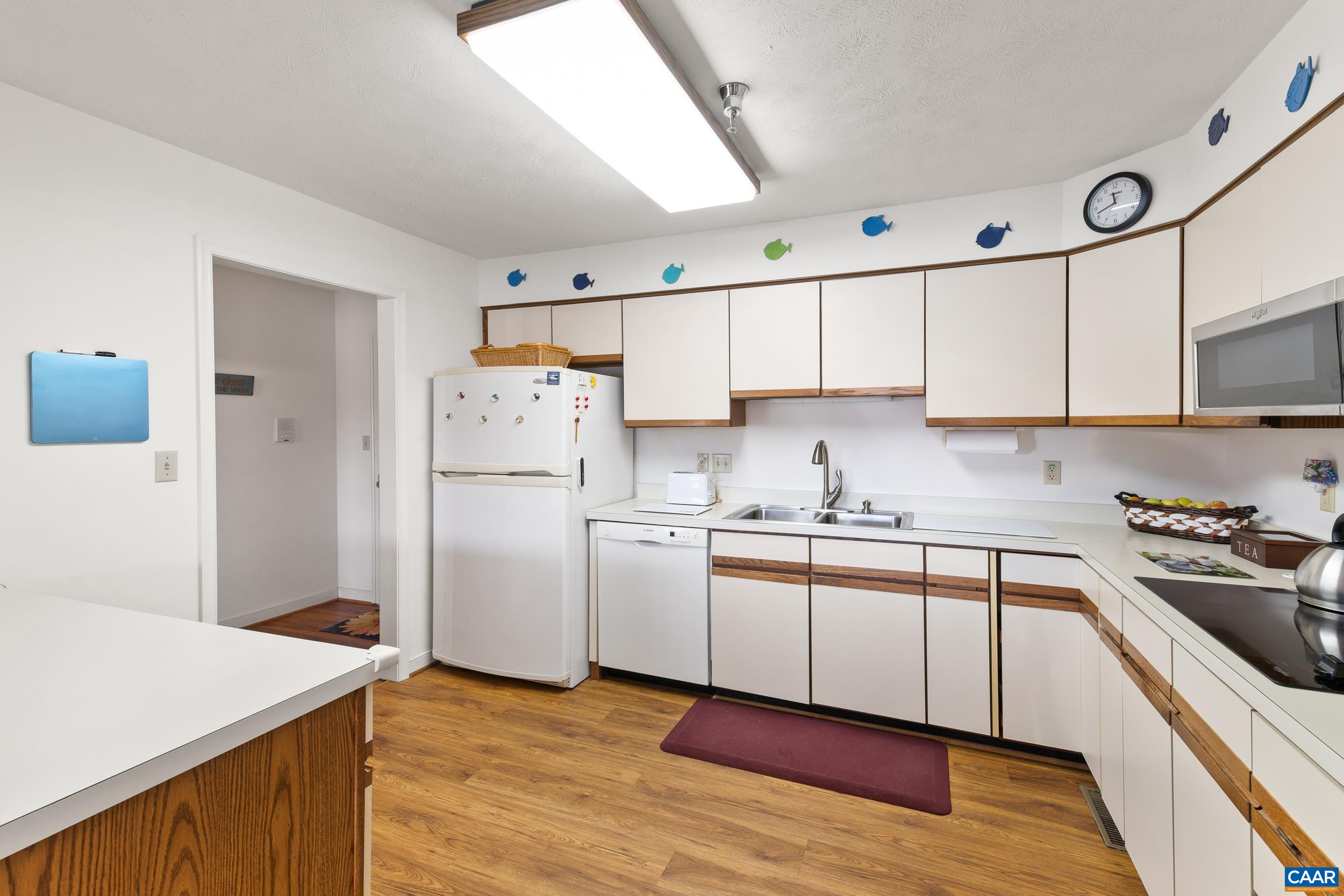C2 Marina Point Palmyra, VA 22963 - Photo 15 of 27 a kitchen with stainless steel appliances granite countertop a sink stove and refrigerator