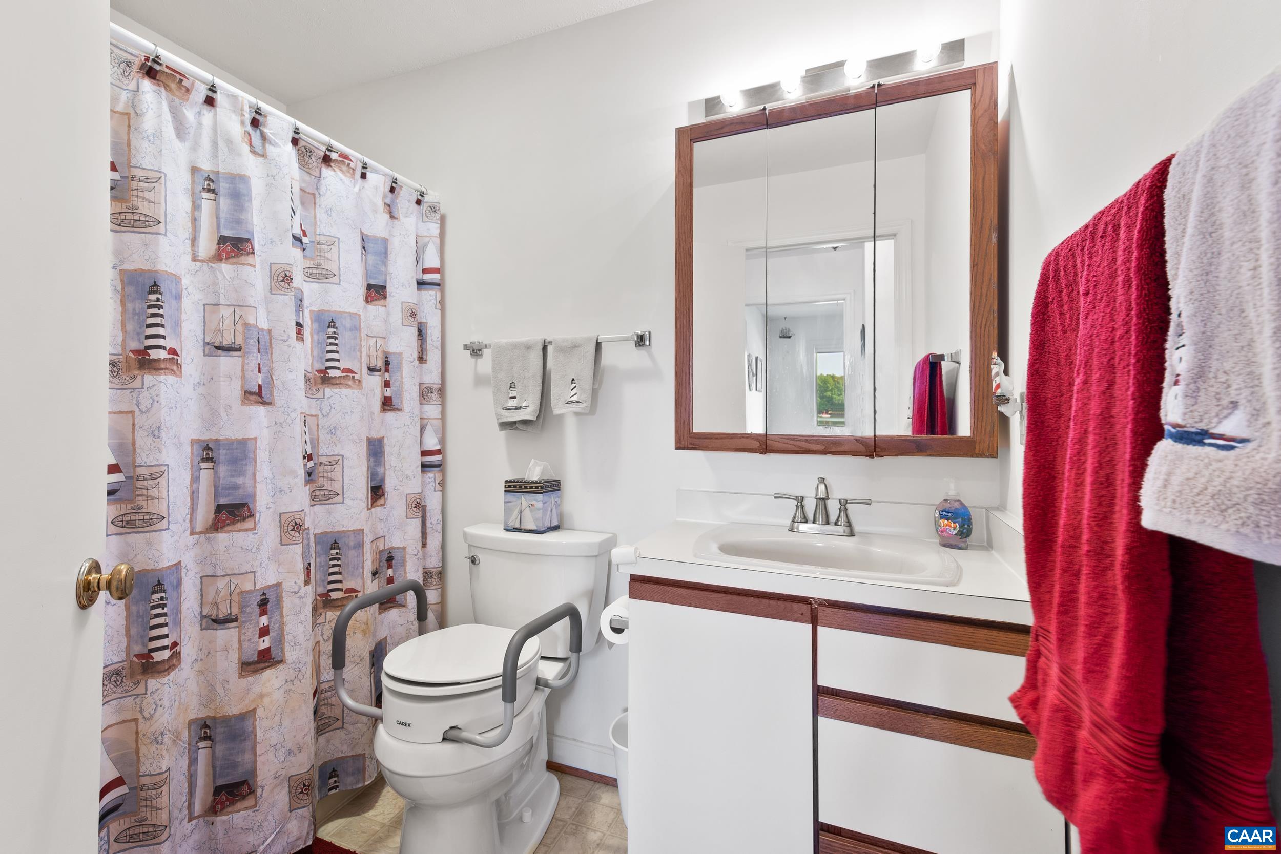 C2 Marina Point Palmyra, VA 22963 - Photo 23 of 27 a bathroom with a sink and a mirror