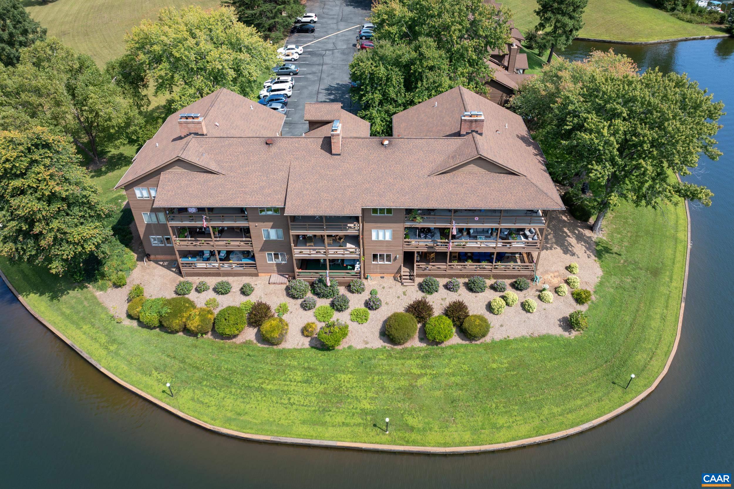 C2 Marina Point Palmyra, VA 22963 - Photo 3 of 27 a view of a swimming pool with a garden