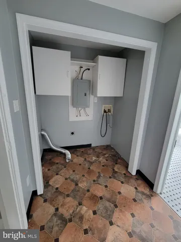 a bathroom with a sink toilet a tub and window