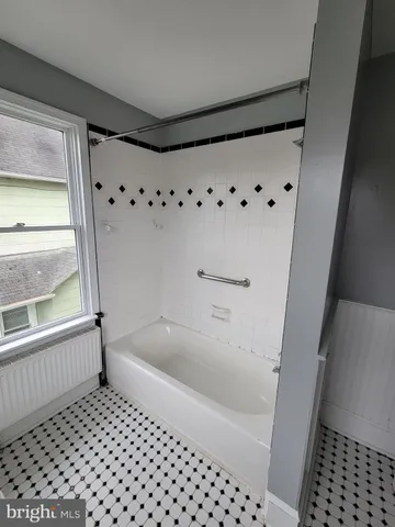 a view of empty room with windows