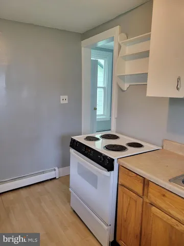 a bathroom with a bathtub and a shower curtain