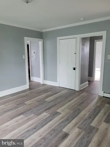 a room with a closet and a mirror