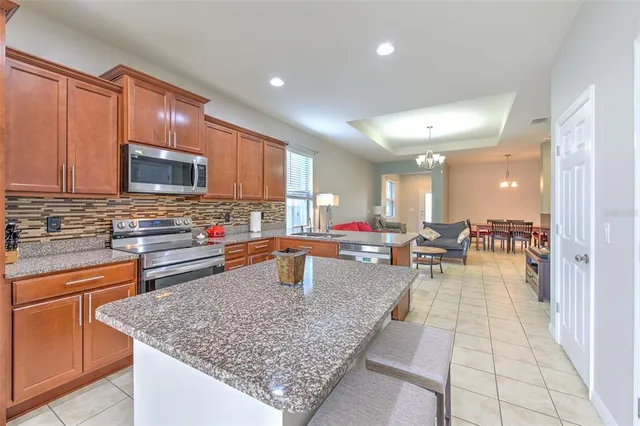 a kitchen with counter top space cabinets and appliances