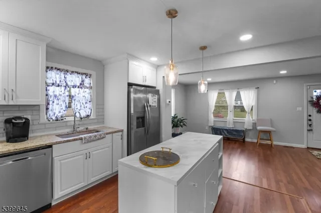 a kitchen with a sink stove and refrigerator