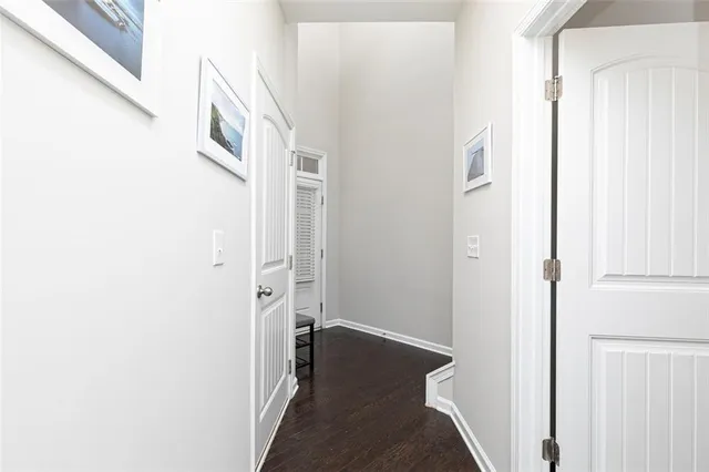 a view of a hallway with a white walls