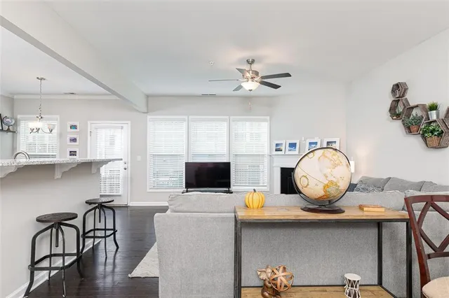 a view of dining room and kitchen with furniture and wooden floor