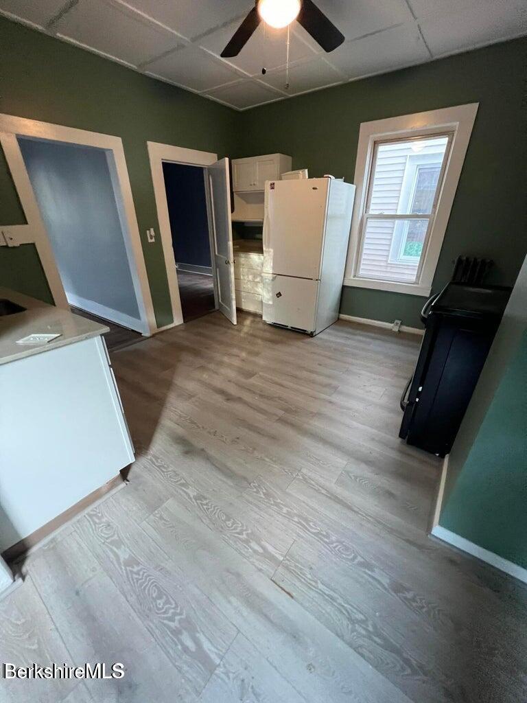 98 Lincoln Street, Unit A Pittsfield, MA 01201 - Photo 7 of 11 a view of a livingroom with furniture and wooden floor