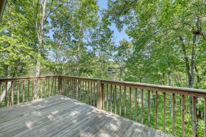 441 Foxfire Road Blairsville, GA 30512 - Photo 20 of 73 a balcony with wooden floor and fence
