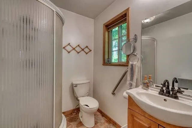 a utility room with sink dryer and washer