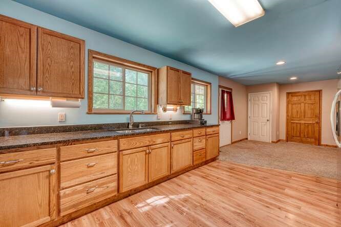 441 Foxfire Road Blairsville, GA 30512 - Photo 7 of 73 a large kitchen with granite countertop a large window and a sink