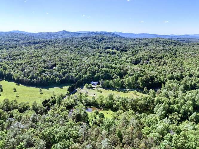 441 Foxfire Road Blairsville, GA 30512 - Photo 71 of 73 a view of a lush green field with mountains in the background