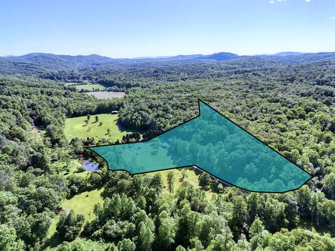 441 Foxfire Road Blairsville, GA 30512 - Photo 72 of 73 a view of a lush green hillside and a houses