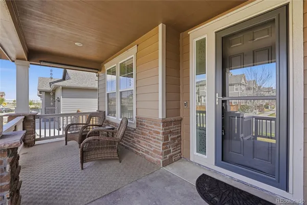 a balcony with furniture and outdoor view