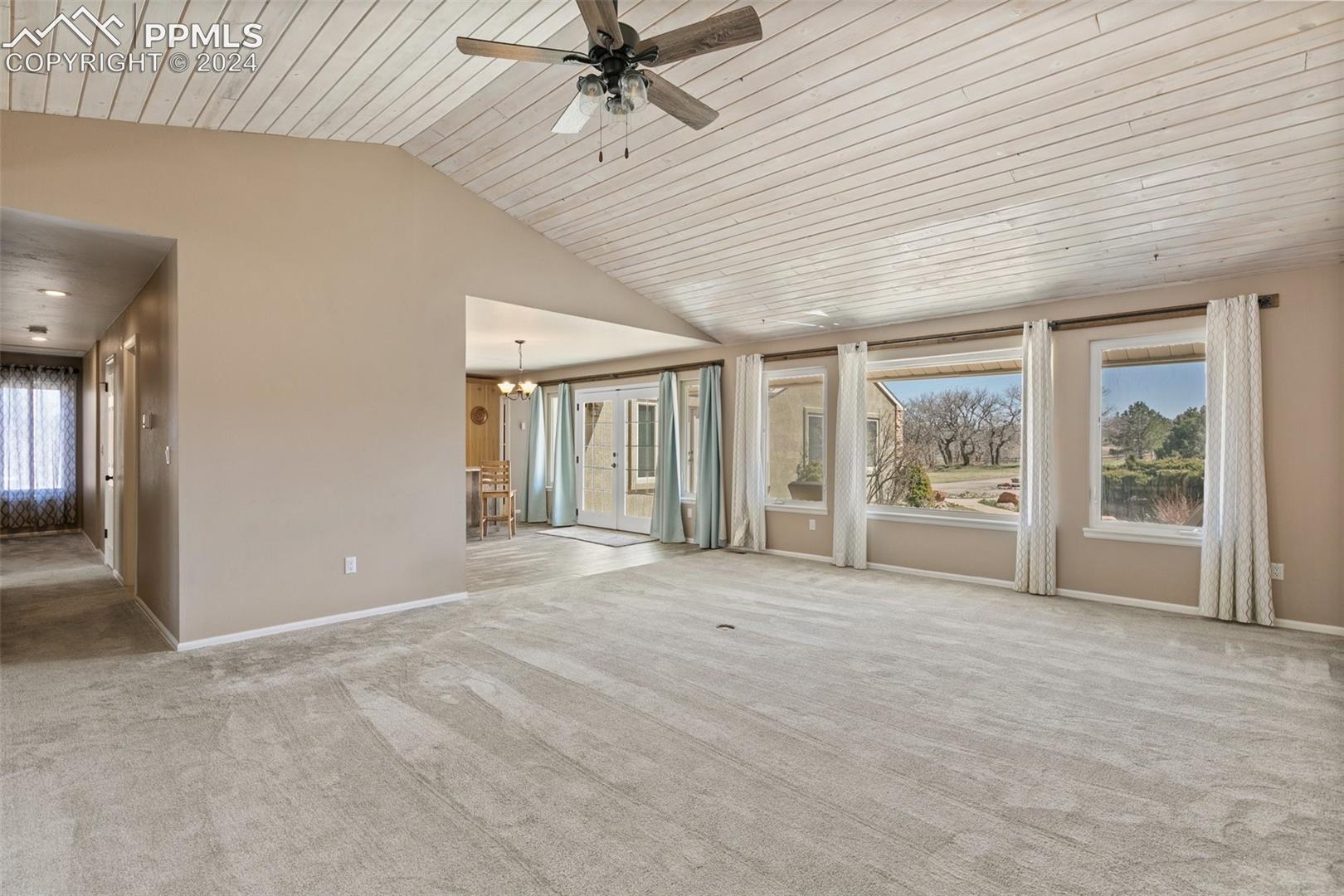 3830 Range View Road Monument, CO 80132 - Photo 15 of 50 Opposite view of living room. The large windows and skylights provides ample natural lighingt.