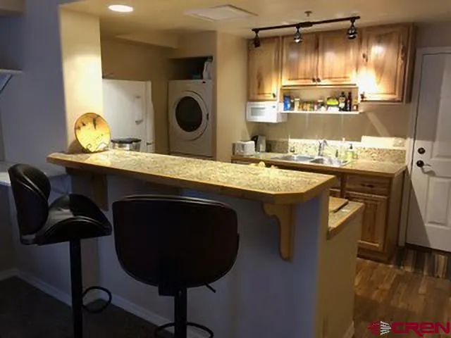 a kitchen with a table and chairs in it