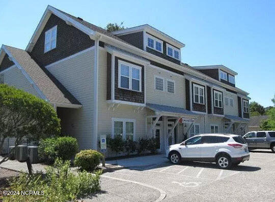 4032 Masonboro Loop Road, Unit 203 Wilmington, NC 28409 - Photo 2 of 8 Exterior rear 2022