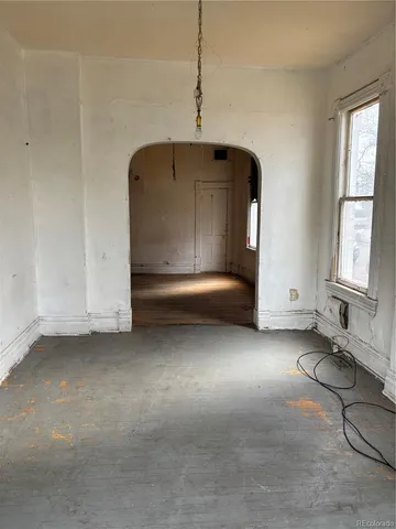 a view of a room with furniture and a window